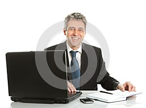 Senior business man working on laptop