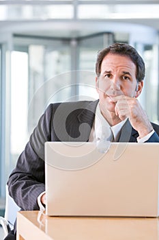 Senior business man working on laptop