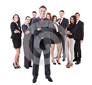 Senior business manager standing on front of his team