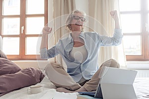 Senior business woman being excited about a success photo