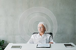 Senior business woman contemplation planning