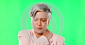 Senior, business woman and neck pain, green screen and muscle tension with inflammation on studio background. Female