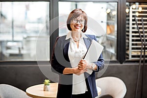 Senior business woman portrait indoors