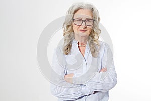 Senior business woman with stylish glasses and wrinkle face isolated on white background. Mature healthy lady. Copy space. Seniors