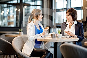 Business women during a coffee time in the cafe