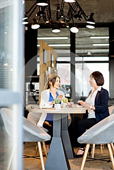 Business women during a coffee time in the cafe