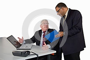 Senior businessman being instructed by his boss