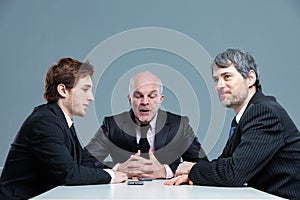 Senior businessman boring his colleagues