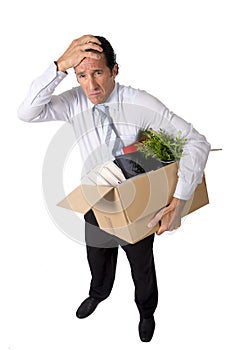 senior businessman carrying office box fired from work sad desperate depressed after loosing job