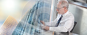 Senior businessman checking document; multiple exposure