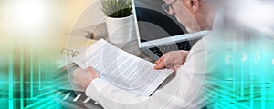 Senior businessman checking document; multiple exposure