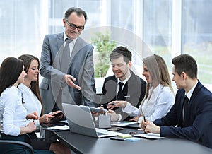 Senior businessman discussing with business team to work issues