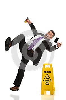 Senior Businessman Falling on Wet Floor