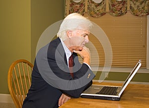 Senior Businessman on Laptop