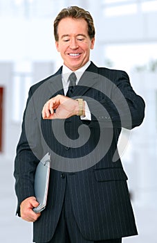 Senior Businessman Looking At His Watch