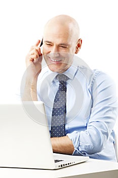 Senior businessman making call