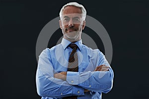 Senior, businessman and portrait or arms crossed in studio with confidence and pride for corporate career or job. Mature