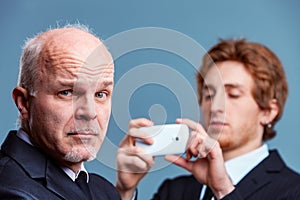 Senior businessman pulling a quizzical face