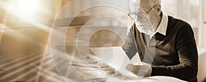 Senior businessman reading a document; multiple exposure