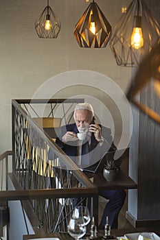 Senior businessman speaking on the phone