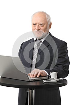 Senior businessman using computer photo