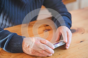 Senior businessman using mobile phone. Focus on hand.  Happy elderly senior people society lifestyle technology concept