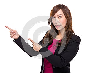 Senior businesswoman with finger point out