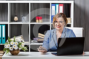 Senior businesswoman working in office
