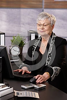 Senior businesswoman working in office