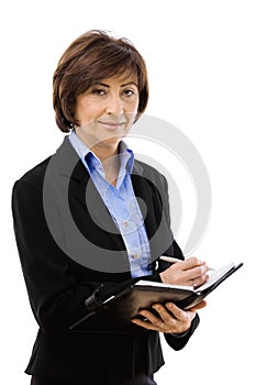 Senior businesswoman writing