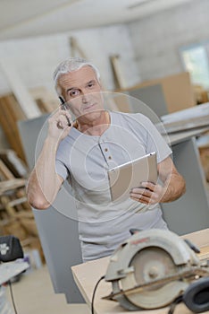 senior carpenter embracing technology