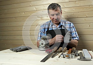 Senior carpenter working in his workshop