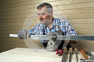 Senior carpenter working in his workshop