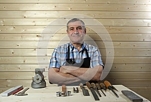 Senior carpenter working in his workshop