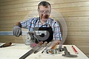 Senior carpenter working in his workshop