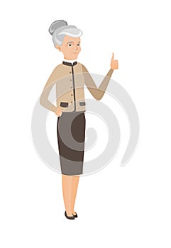 Senior caucasian business woman giving thumb up