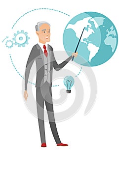 Senior caucasian businessman pointing at a globe.