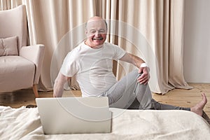 Senior caucasian man doing yoga Spine twisting pose