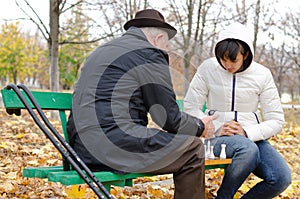 Senior Caucasian man spending quality time playing chess with his young granddaughter