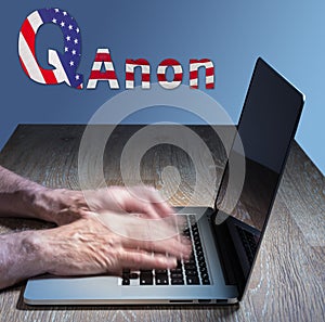 Senior caucasian man types about Q Anon deep state conspiracy