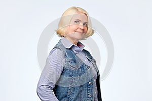 Senior caucasian woman with blonde hair in casual clothes smiling