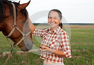 Senior caucasian woman with horse