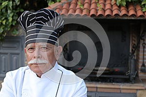 Senior chef in traditional kitchen