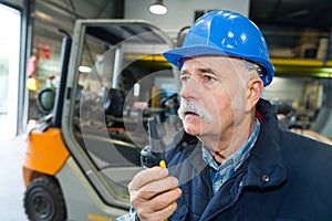 senior chemical industry worker inside plant photo