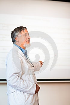Senior chemistry professor giving a lecture