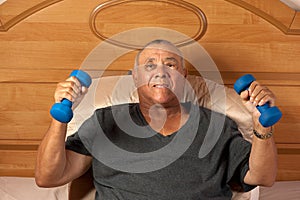 Senior citizen with dumbbells