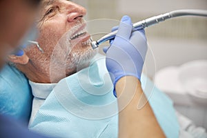 Senior citizen having his regular dental appointment