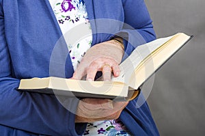 Senior Citizen reading a book.