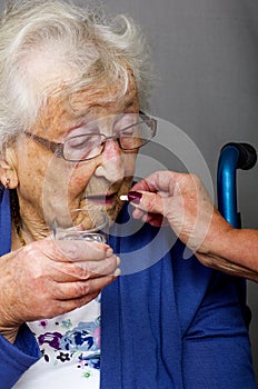 Senior Citizen taking Pill