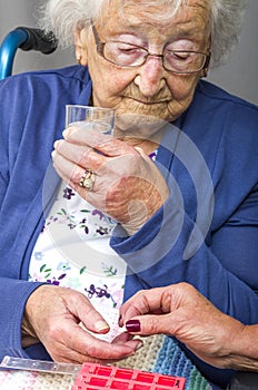 Senior Citizen taking Pill